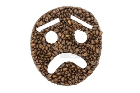 Foto de Coffee beans arranged on a white background to look like an emoji - Imagen libre de derechos