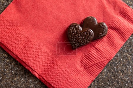 Photo for Close up of heart shaped chocolates on a red napkin - Royalty Free Image