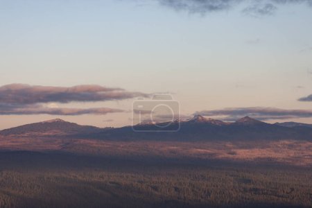 Photo for Close up of the Harvest Supermoon rising over Crater Lake National Park viewed from the distance - Royalty Free Image