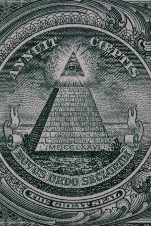 Photo for Close up of a small section of a one dollar bill showing the all seeing eye and the pyramid. - Royalty Free Image