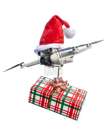 Photo for Drone concept wearing a santa hat and holding a wrapped gift out for delivery isolated on a white background. - Royalty Free Image
