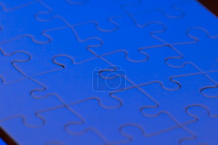 Photo for Close up of a blank puzzle with a blue light as a concept - Royalty Free Image