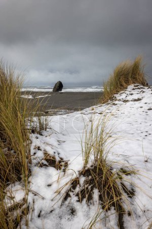 Photo for Kissing rock just south of Gold Beach covered in snow February 2023 - Royalty Free Image