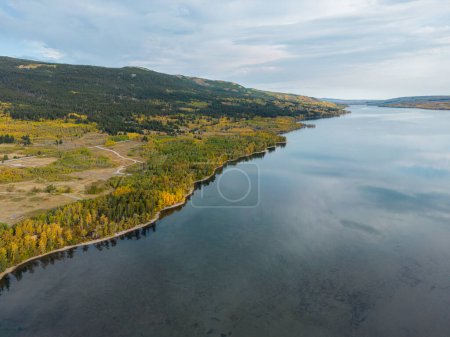 Photo for Lower St Mary lake from above with beautiful autumn colors in the forest. - Royalty Free Image