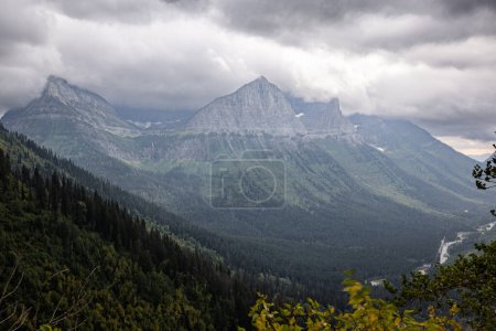 Photo for Beautiful and dramatic landscape of the mountains with fog and low clouds in Glacier Montana - Royalty Free Image