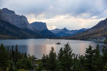 Photo for One of the most popular and scenic viewpoints in Glacier National Park, the view of Goose Island in St Mary Lake near the East entrance to the park - Royalty Free Image