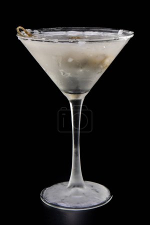 Photo for Chilled vodka martini with bleu cheese stuffed olives isolated over a black background - Royalty Free Image