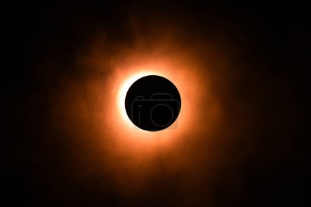 Photo for Eclipse image created in a studio using a bright flashlight, a round cap and a can of atmospheric spray for, well, atmosphere. - Royalty Free Image