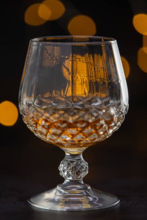 Photo for A glass of liquor in a glass with a stem. The image has a mood of relaxation and enjoyment - Royalty Free Image