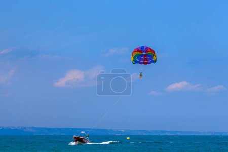 Photo for Image of tourists parasailing at sea - Royalty Free Image