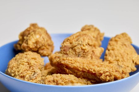crispy chicken wings in a bowl.