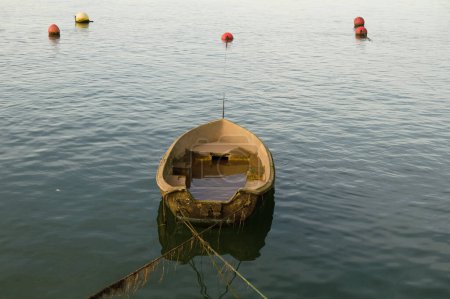 Cantabria, Bay of Santander, semi sunk fishing boat by the shore