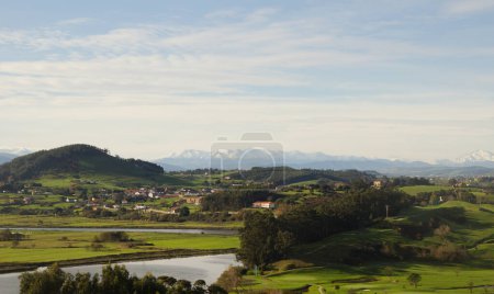Cantabria, view inland over Liencres area, snow on Picos de Europa mountain range