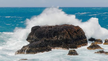 Gran Canaria, Roque Matavinos islet where a small colony of terns is located being washed over by big waves, edge of  Las Palmas 