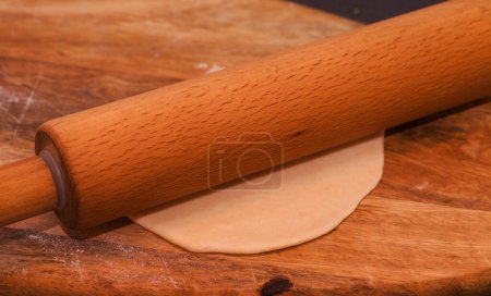 Photo for Making sourdough leavened pita-like flatbread on dry frying pan - Royalty Free Image