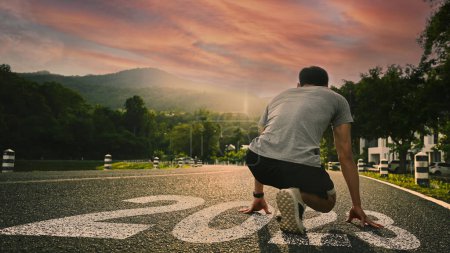 Photo for Rear view of athletic man in start position. Concept of challenge, goals, beginning and start of the new year 2023. - Royalty Free Image
