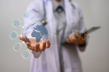 Hands of doctor showing global medical healthcare network connection icons. Health care and technology concept.