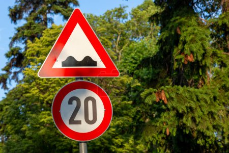 Photo for Speed limit road signs and Rough road Warning - Royalty Free Image