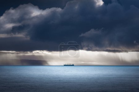 Photo for Ship travelling through a storm - Royalty Free Image