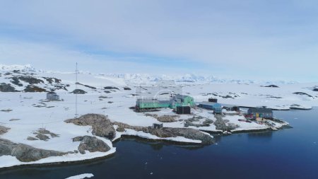 Antarctica peninsula vernadsky station aerial view. Arctic Ocean Coast Melting Ice at Pole Base, Majestic Nature Panorama Global Warming Concept Top Drone Flight Footage Shot in 4K UHD