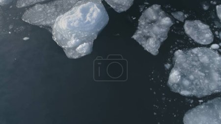 Antarctic Drone Flight Over Float Ice Ocean. Open Water Glacier at South Pole Antarctica Helicopter Top Down View. Global Climate Change Concept Footage Shot in 4K UHD
