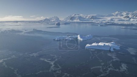 Antarctica Aerial Majestic Seascape Drone View. Open Water Antarctic Ocean Coast Nature Mountain Beauty. Cold South Pole Winter Landscape Helicopter Above Pan Left Footage 4K UHD
