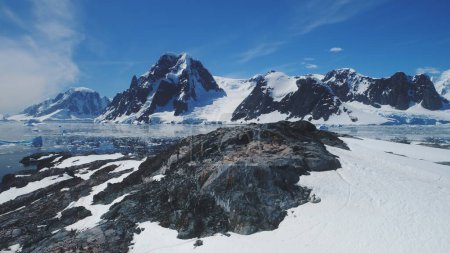 Antarctica Mountain Continent Scenery Aerial View. Majestic Arctic Ocean Snow Island Panorama Global Warming Concept. Epic Cold Polar Landscape Overview Drone Flight Footage 4K UHD