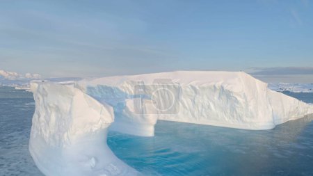 Antarctica Big Iceberg Float Aerial Tracking View. Melting Ice and Global Warming Concept. Arctic Ocean Massive Tabular Landscape. Majestic Polar Nature Panorama Drone Flight