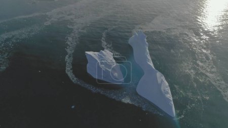 Iceberg Float Open Water Ocean Drone Aerial View. Huge Ice Melt Global Antarctica Climate Change Concept Tracking Flight. Winter Polar Glacier Arctic Seascape