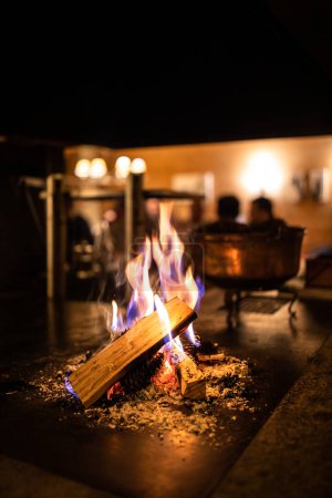Photo for Open fireplace in a cosy restaurant - Royalty Free Image