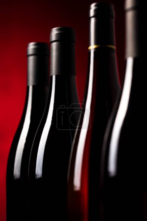 Photo for Bottles of quality red wines shot with shallow DOF; color toned image - Royalty Free Image