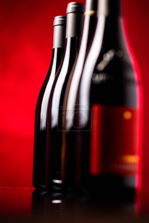 Photo for Bottles of quality red wines shot with shallow DOF; color toned image - Royalty Free Image