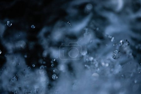 Photo for Water concept - river water flowing with light reflecting of its surface - long exposure shot - Royalty Free Image