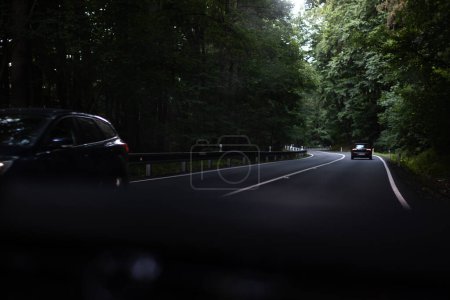 Photo for Cars driving fast on the highway (shallow DOF) - Royalty Free Image