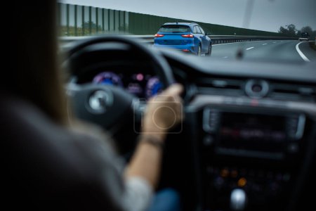 Photo for Cars driving fast on the highway (shallow DOF) - Royalty Free Image