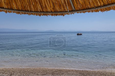 Empty beach in Benitses, Corfu Island in Greece