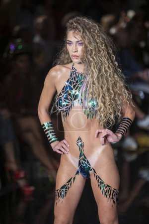Photo for A model walks the runway for the Black Tape Project Fashion Show during Art, Hearts, Fashion Swim Week at the Faena Forum in Miami Beach on 7- 11- 2021 - Royalty Free Image