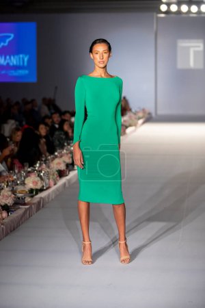 Photo for A model walks the runway during the Catwalk for Charity Fashion Show for the Designer Trang Phung Fashions at the Ritz Carlton in Key Biscayne, Florida on October 24th, 2021 - Royalty Free Image