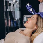 Woman getting a facial dermapen treatment at spa salon. Beauty concept. Face cosmetic procedure. Cosmetology. Skin Lift Procedure.