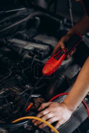 Photo for Servicing car air conditioner in auto repair shop. High quality photo - Royalty Free Image