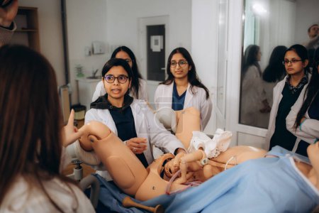 practical training of gynecology students on training obstetrics on a mannequin.