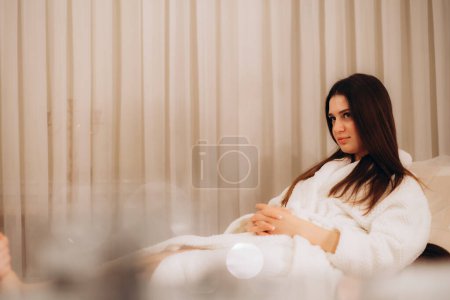 Beautiful woman relaxing in a beauty spa hotel - Client having a beauty treatment in a beauty spa salon, female adult having a relaxing day in hot spring bath