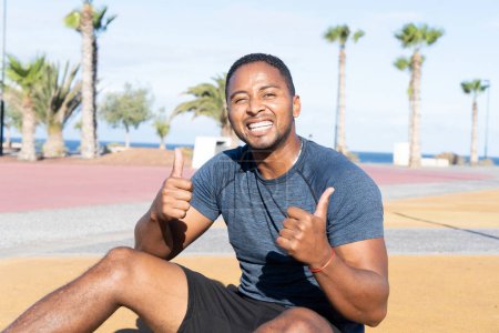 Photo for Sport workout of african american men, smiling after workout on outdoor sportground - Royalty Free Image