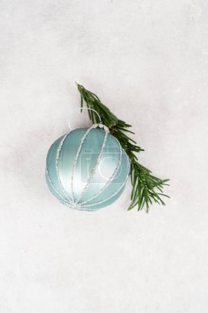 Photo for Christmas silver and teal decoration ball over gray background - Royalty Free Image
