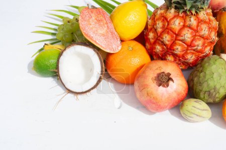 Photo for Summer mix of tropical fruits over white, close up - Royalty Free Image