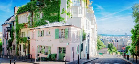 View of cosy street with old houses in quarter Montmartre in Paris, France. Cozy cityscape of Paris at summer. Architecture and landmarks of Paris, web banner format, toned