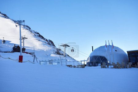 Photo for Hotel and Restaurant from round dome house complex at Ski resort Shymbulak in Almaty, Kazakhstan. Winter snowfall outdoor tourism concept. - Royalty Free Image