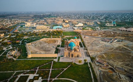 Aerial drone view of Mausoleum of Khoja Ahmed Yasavi in the city of Turkestan ancient building at sunset in South Kazakhstan