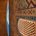 Exterior of old building Gur Emir Mausoleum with minaret and blue dome of Tamerlane Amir Timur in Samarkand, Uzbekistan