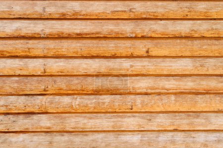 High-resolution image showing the textured surface of warm-toned wooden slats, suitable for backgrounds and design elements.